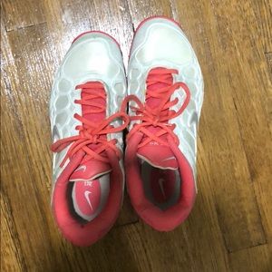 Pink/white Nike tennis court shoes